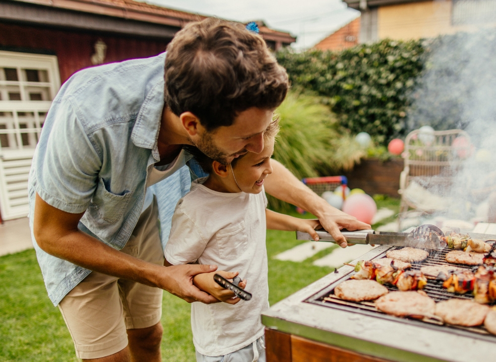 Father and son at a barbecue