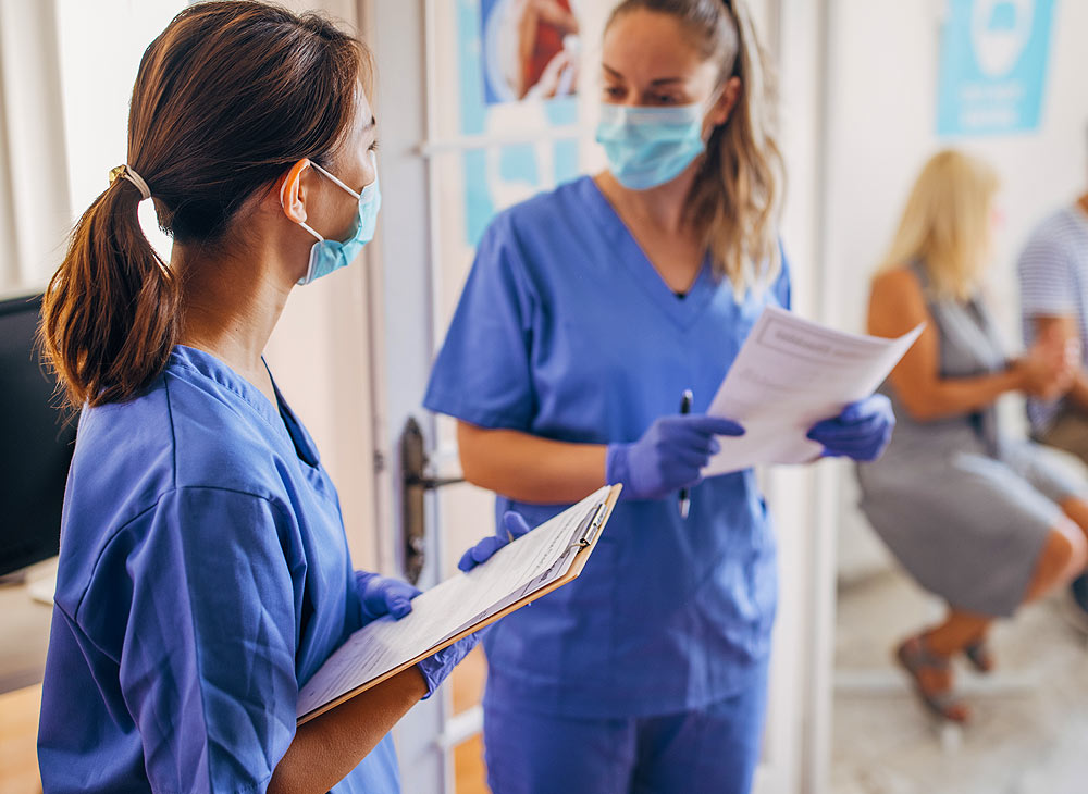 Clinicians in scrubs